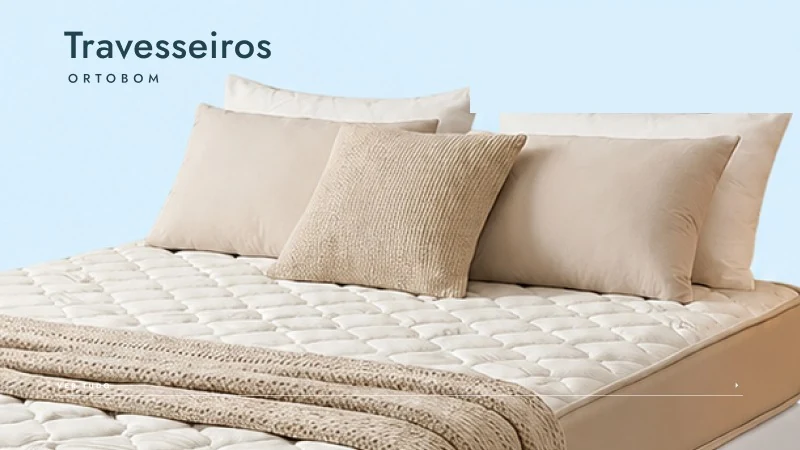 Cama arrumada com travesseiros Ortobom